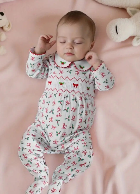 Holly & bows smocked sleep suit